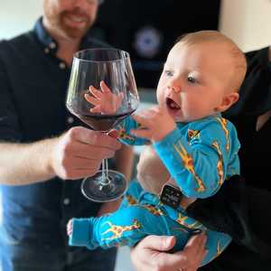 Attempting to try the wine at Thanksgiving