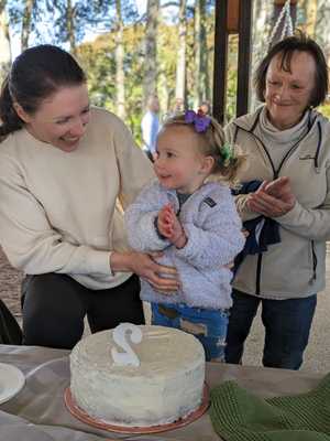 Avery at her second birthday with Annika and her grandmother