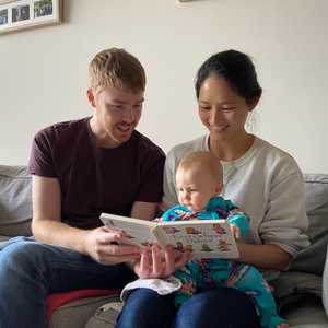 Reading with her Aunt and Uncle